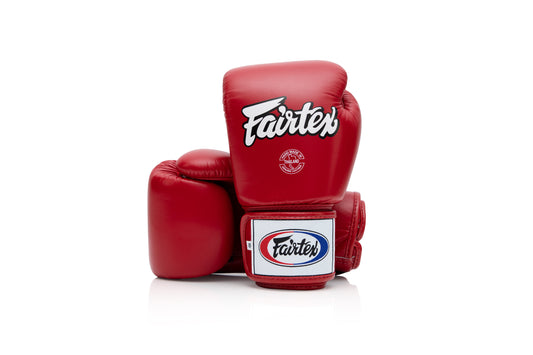 Fairtex BGV1 Boxing Gloves – red Thai leather gloves with ergonomic fit and Velcro wrist strap.