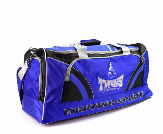 Twins BAG2 Gym Bag – blue gear bag with zippered compartments and Twins branding for Muay Thai and boxing.