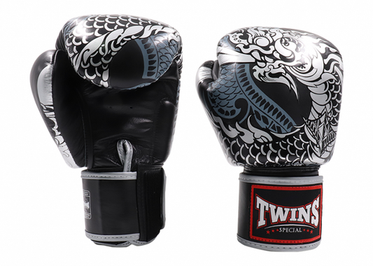 Twins Fancy Boxing Gloves “NAGAS” – silver and black Thai leather gloves with serpent design and Velcro wrist strap.